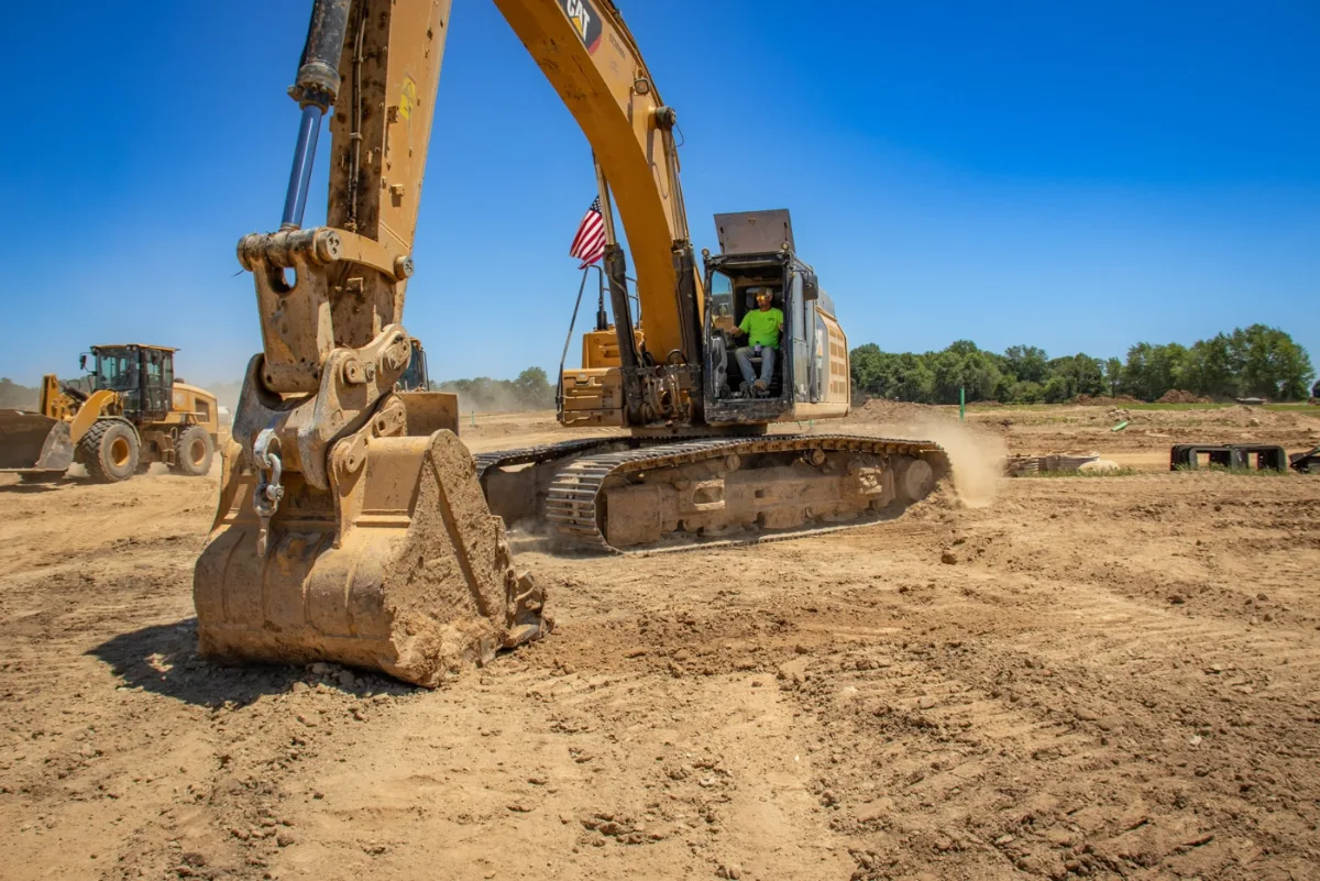 Excavator working ground on a Graber Real Estate development project